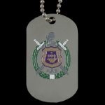 Dog tag with emblem and two swords on a reflective surface