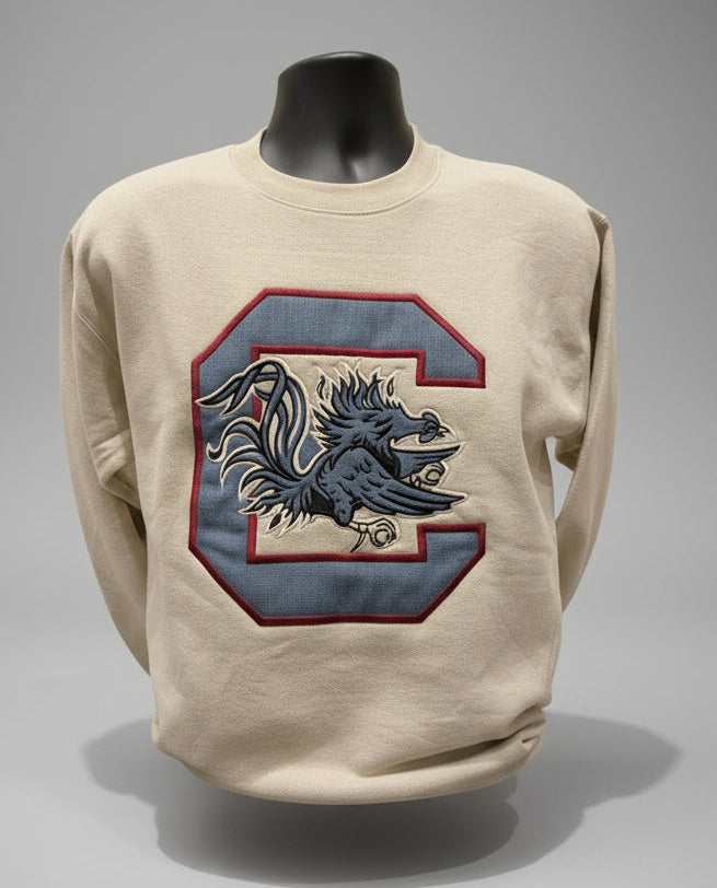 cream sweatshirt with a usc gamecock on a gray background
