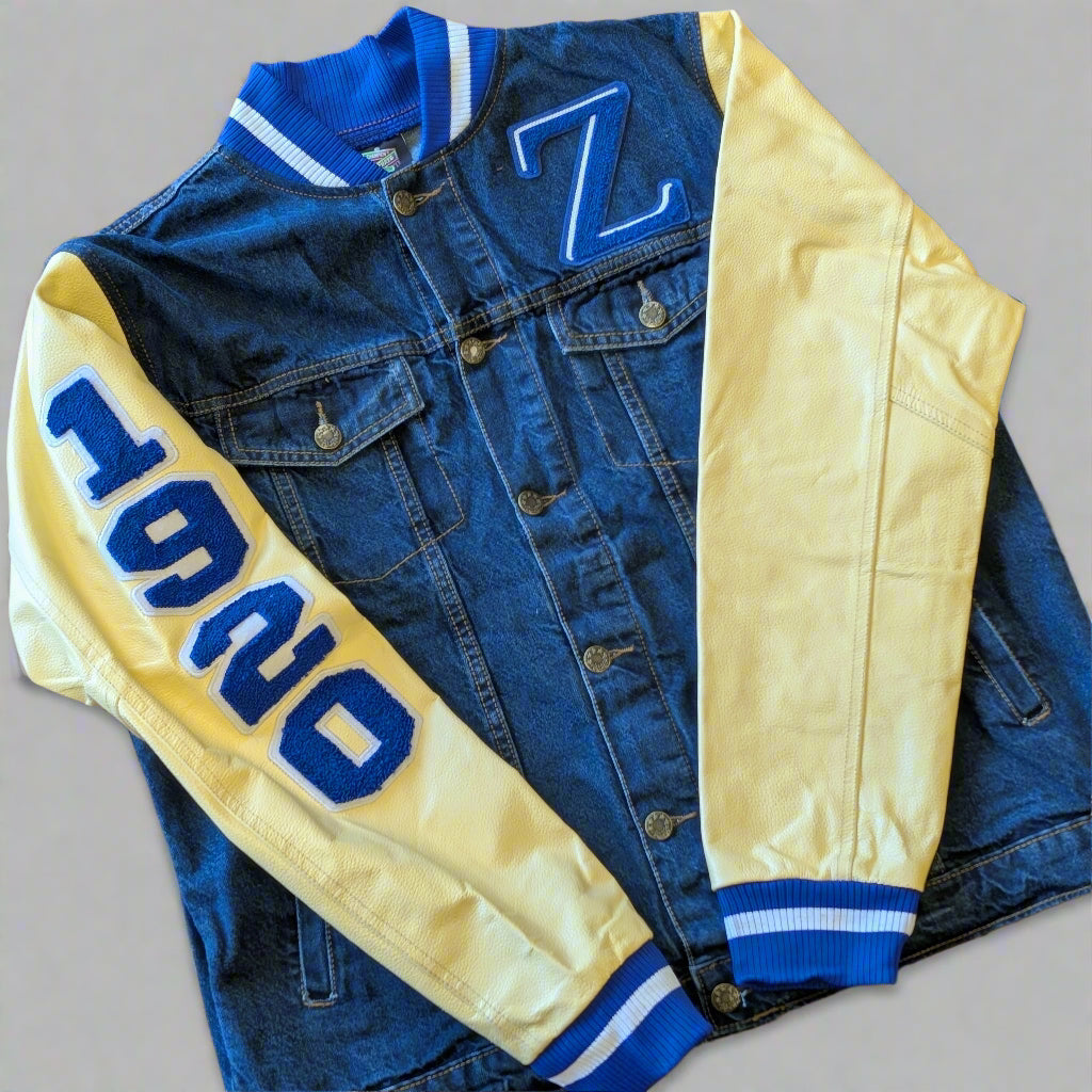 denim varsity jacket with blue letterng and cream sleeves
