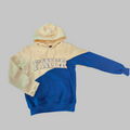 Two-tone beige and blue hoodie with 'FINER' text on a gray background