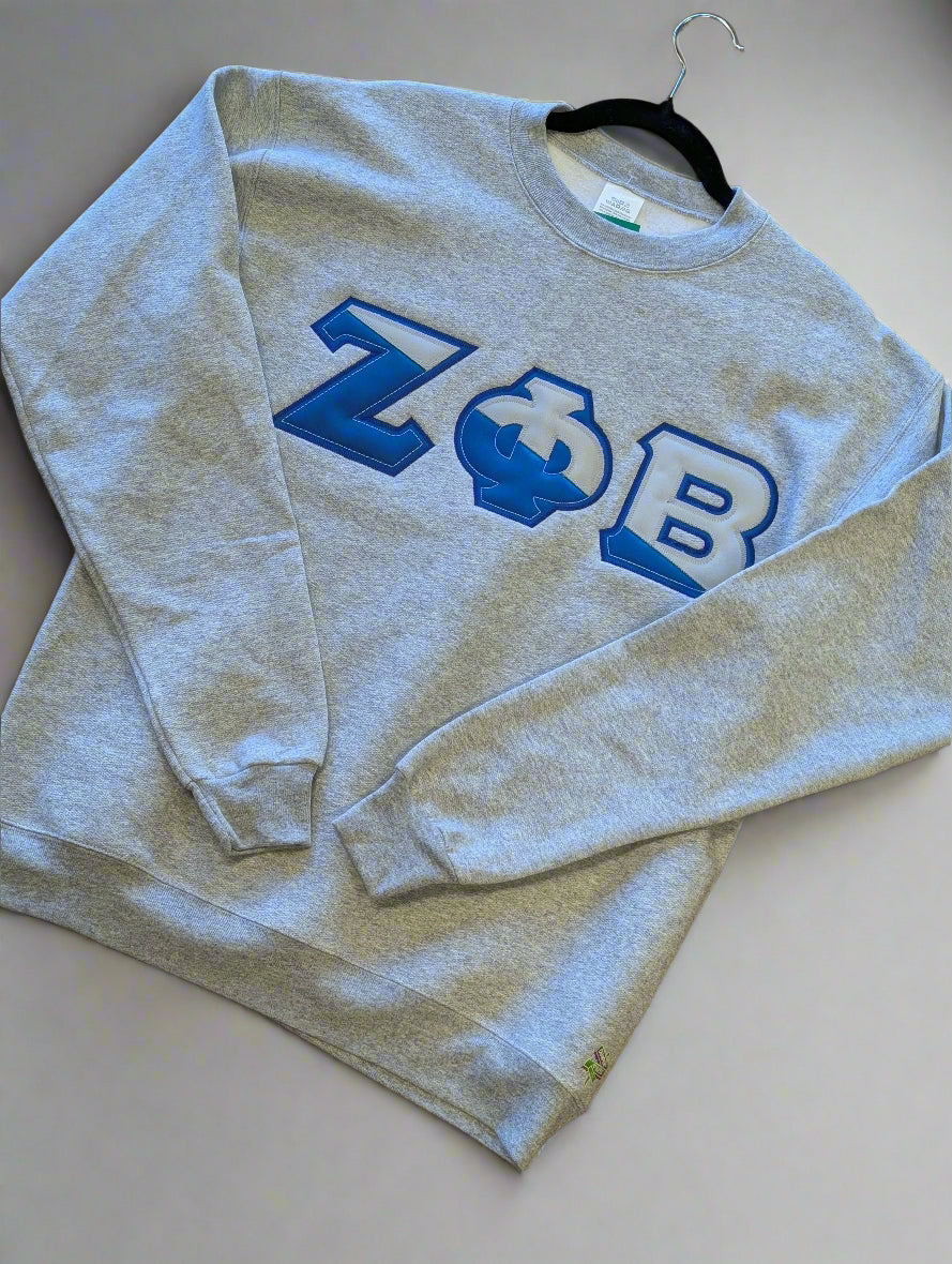 Blue sweatshirt with letters printed on it