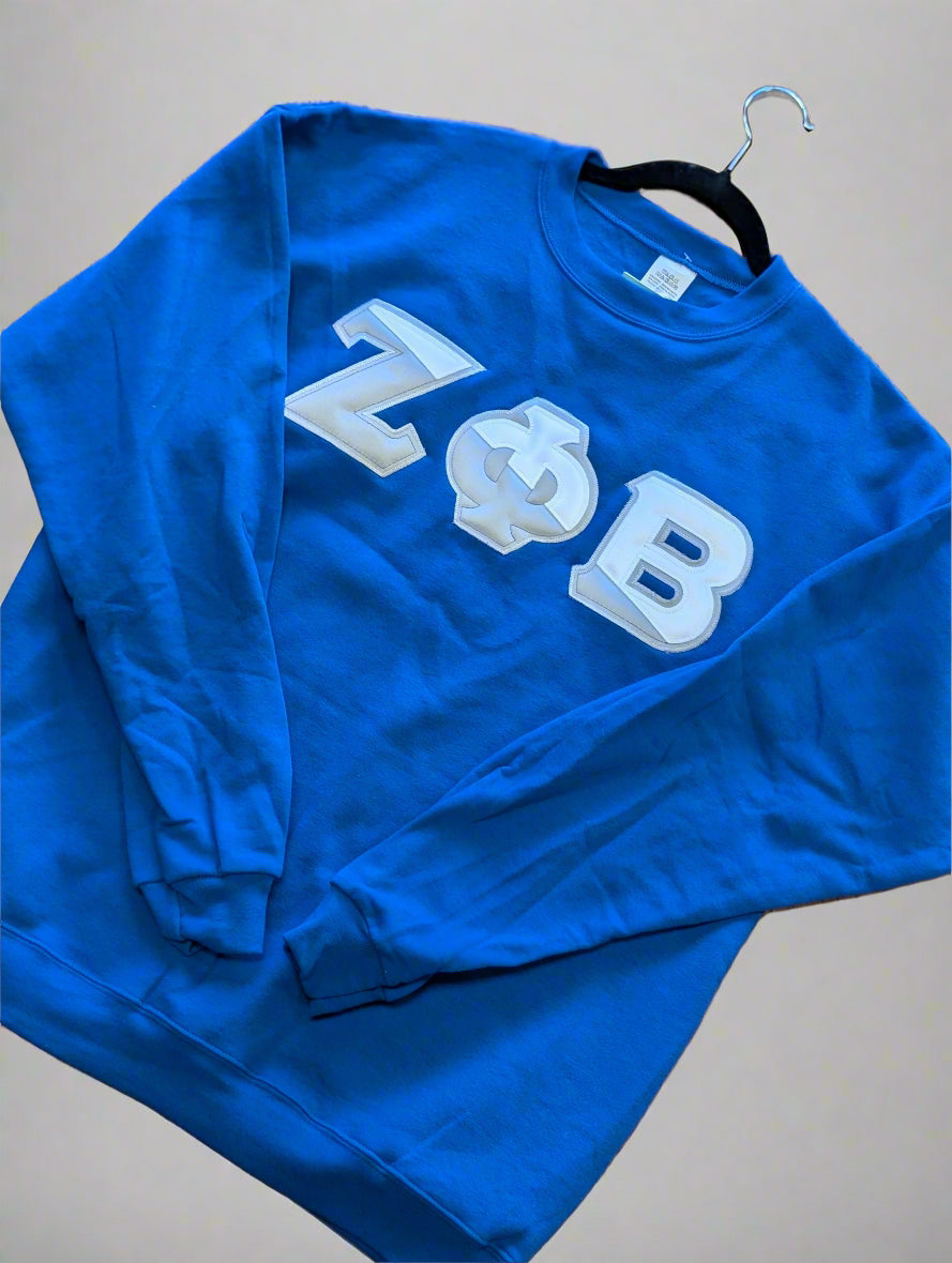 Blue sweatshirt with letters printed on it