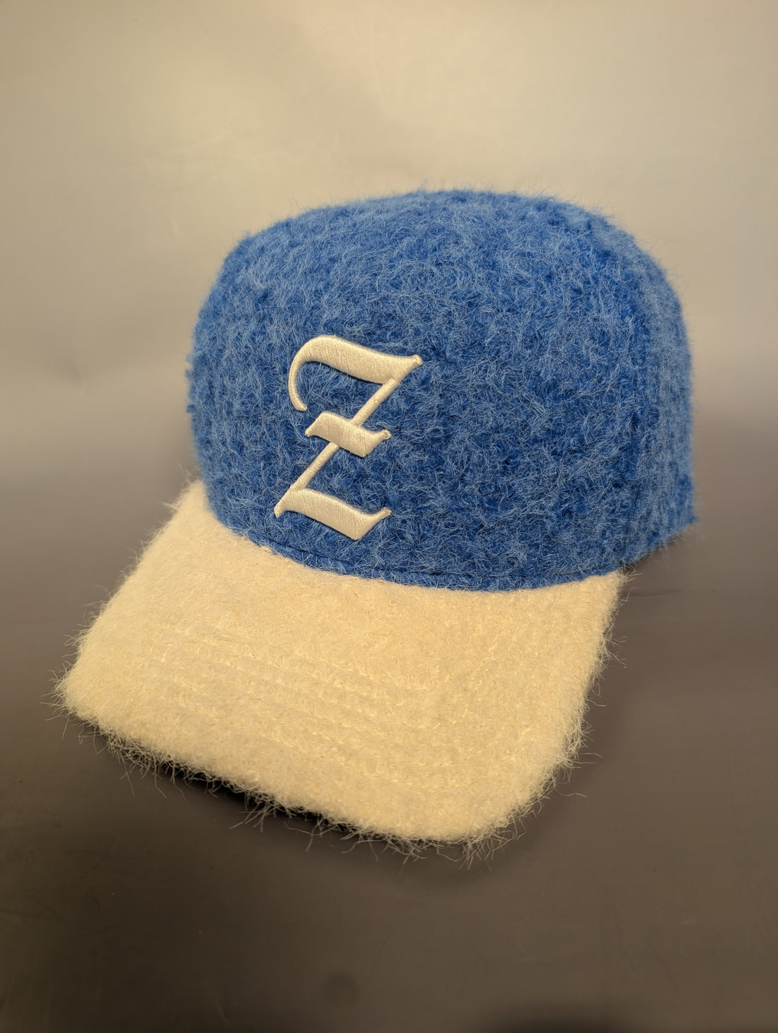 Blue and cream cap with Z embroidered on it