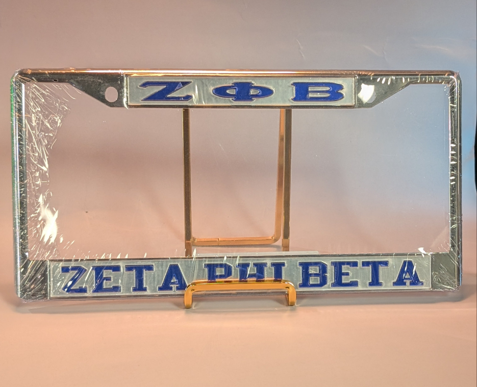Zeta Phi Beta license plate frame with blue text on a reflective surface